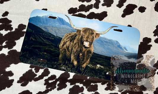 Mountains + Highland Cow License Plate